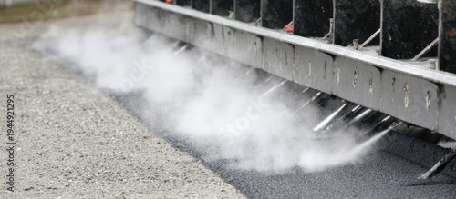 Road maintenance vehicle spraying water.