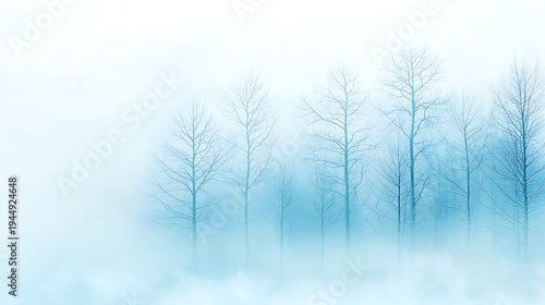 Ethereal Winter Landscape with Fog and Bare Trees in Soft Blue Hues for Tranquil Atmosphere