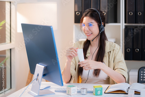 Young asian creative woman development packaging cosmetic and skincare product design with AI artificial intelligence, businesswoman using headset with marketing for conference online, call center.