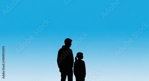 Silhouette of a father and daughter looking out at the horizon.