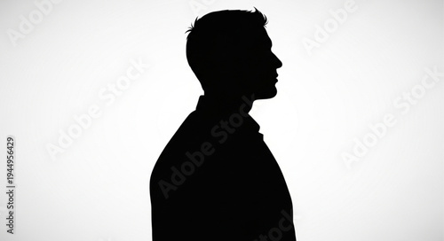 Silhouette of a man in profile against a white background.