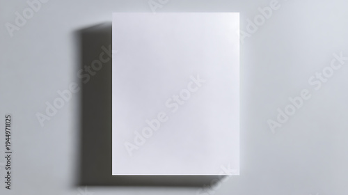 Blank white sheet with soft shadow on gray surface