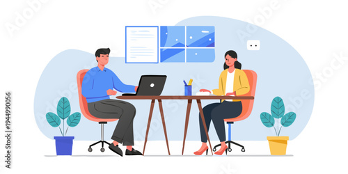 Two professionals collaborate during a meeting in a modern office space