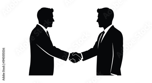 Silhouettes of two businessmen shaking hands in a formal agreement