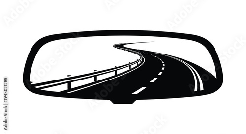 A winding road stretches into the distance as viewed through a rear view mirror silhouette high quality