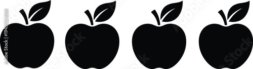 Set of four black apple fruit silhouettes with leaves for healthy food icons organic farm product labels and educational graphics