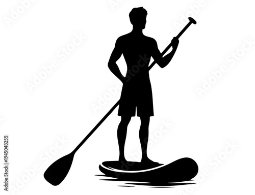 Silhouette of a man standing on a paddleboard with a paddle
