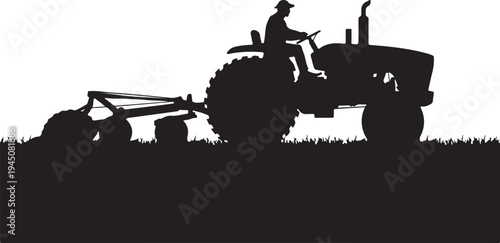 Black silhouette of man driving tractor with plow through grass