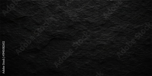 A dark grunge black paper background features a rough macro texture with a grey stone pattern and old leather material surface