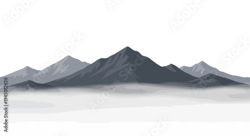 Majestic mountain range shrouded in ethereal mist at dawn.