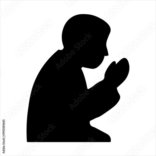 Black silhouette of a person kneeling in prayer or meditation, hands clasped together in a reverent posture.