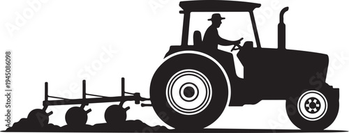 Black silhouette of tractor with driver plowing soil