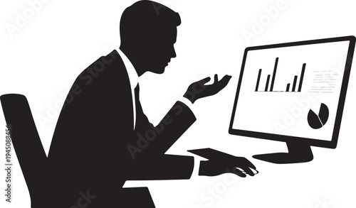 Man in suit sitting at desk looking at computer screen with graphs