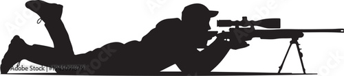 Silhouette of man lying down aiming rifle with scope