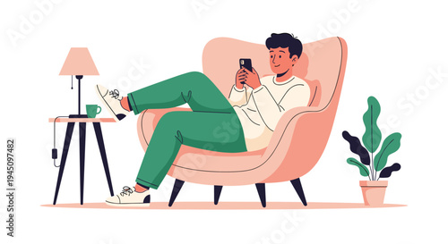 Relaxed young man sitting in a comfortable armchair at home while scrolling on his smartphone in a cozy living room with a plant and lamp.