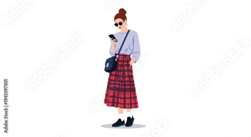 Stylish young woman wearing sunglasses and a long red plaid skirt while checking her smartphone isolated on a plain white background.