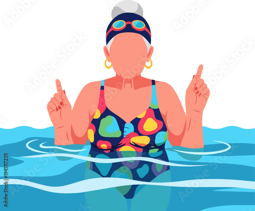 An elderly woman with grey hair wearing a colorful swimsuit, swimming cap, and goggles, standing in a pool with hands raised and fingers pointing up.