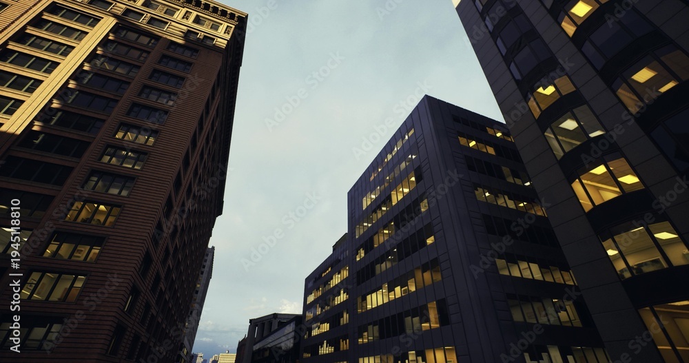 Obraz premium Skyline urban drama, Tall buildings under cloudy sky, Vertical cityscape with glowing window lights, Highrise structures facing brooding overcast sky scene