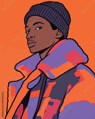 A person stands confidently in a colorful jacket and beanie, facing the viewer in a studio with a bright orange backdrop.