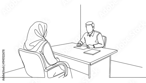 A woman wearing a hijab sitting across from a man at a desk