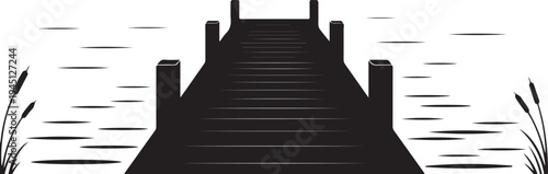 Black silhouette of a dock on a body of water with cattails