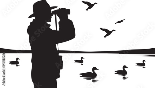 Man in silhouette photographing ducks on water with binoculars