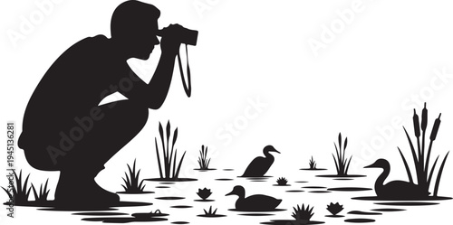 Man photographing ducks in wetland with cattails photographer