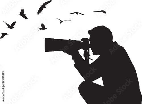 Silhouette of man photographing flying birds photographer