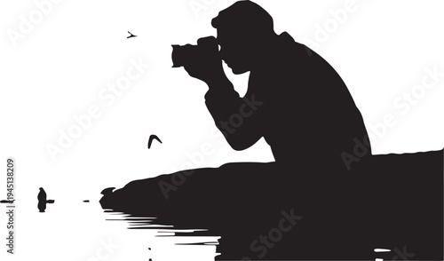 Silhouette of photographer taking by water with birds flying