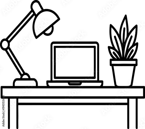 A simple home office setup with a computer and plant