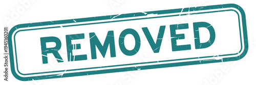 A teal colored stamp displaying the word removed in bold uppercase letters