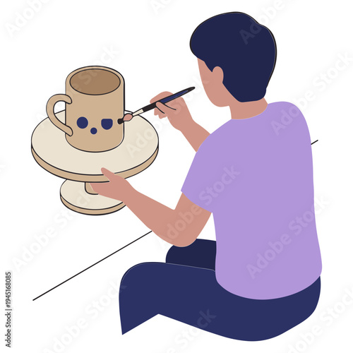 A person carefully paints a ceramic mug on a turntable indoors.