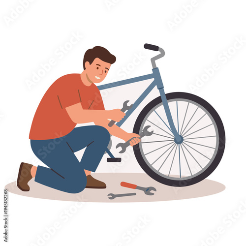 Man fixing bicycle with tools on the ground in a workshop