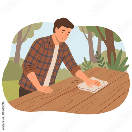 Man cleaning wooden table outdoors in forest with cloth and trees