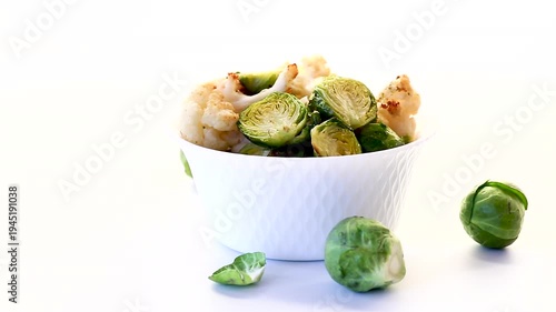 Warm salad with Brussels sprouts on a white background