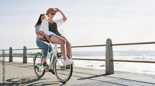 Quadro su tela Happy, cycling and friends on bicycle by ocean for travel on weekend, summer holiday and vacation