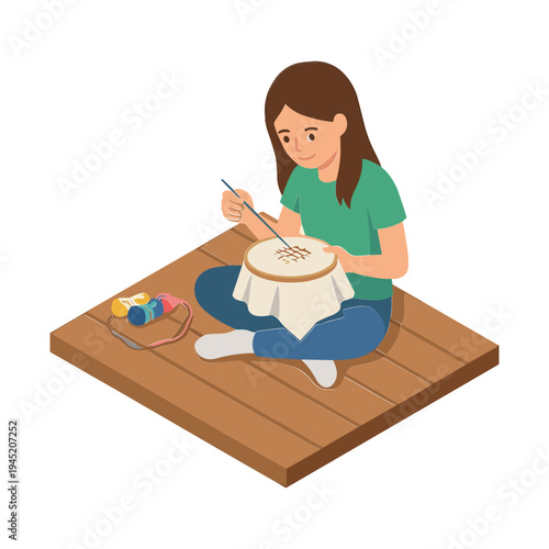 Woman sitting on a wooden floor painting a canvas with a brush