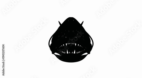 Black silhouette of a deep-sea fish with sharp teeth and glowing eyes