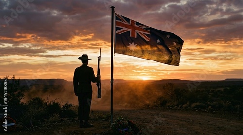Anzac Day, Australian flag, Australian soldier, remembrance, memorial, sunset, patriotism silhouette of a soldier in slouch hat standing at attention in the outback at dusk.
