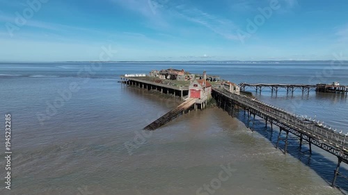 Wallpaper Mural Dramatic aerial drone flyover of abandoned Birnbeck Pier walkway and island Weston-super-Mare Somerset England Torontodigital.ca