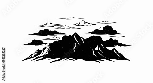 Dramatic mountain range silhouette against a sky filled with clouds