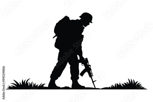 Silhouette of a soldier with rifle in a grassy field