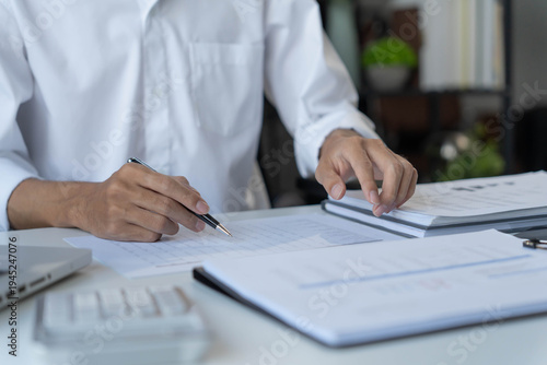 Accountant planning finances on tablet