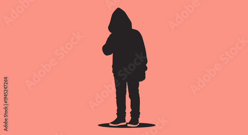 Silhouette of a person in a hoodie, standing against a pink background, conveying mystery and anonymity.