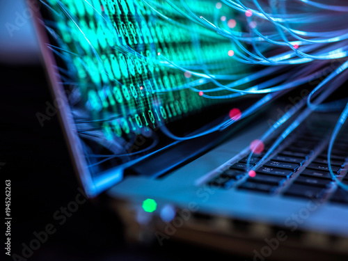 Computer virus and cyber attack visualized on laptop with binary code