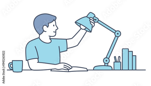 A man adjusting a blue desk lamp while working at his office desk