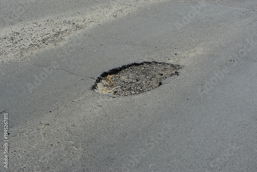 Road pit on asphalt road