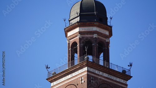 Foto Sforza Castle Main Tower With Clock Against Blue Sky