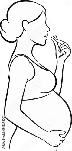 Pregnant woman in profile holding a pill to her mouth