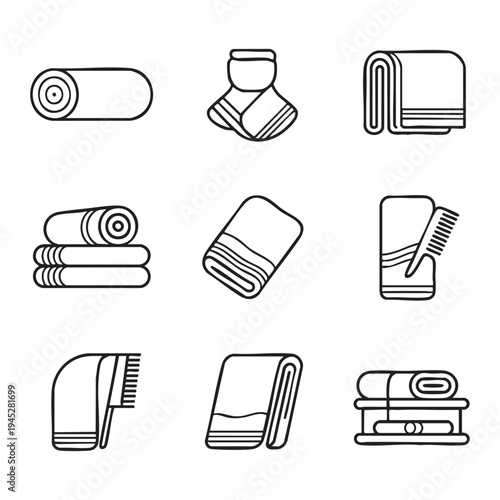 Black and white line of rolled towels and hairbrushes on a plain background line rolled towels